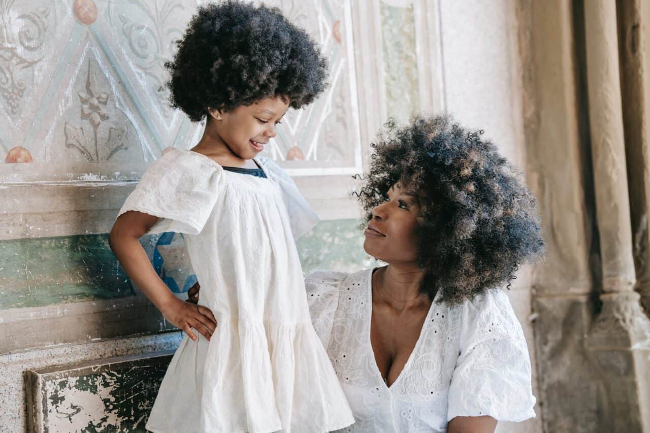 a woman and her daughter looking at each other