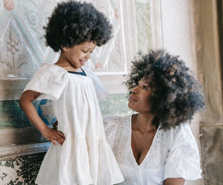 a woman and her daughter looking at each other