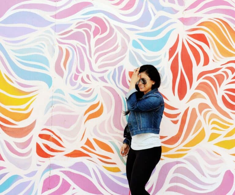 woman in blue denim button down jacket and black pants