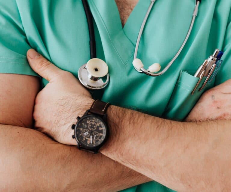 crop unrecognizable male doctor with stethoscope