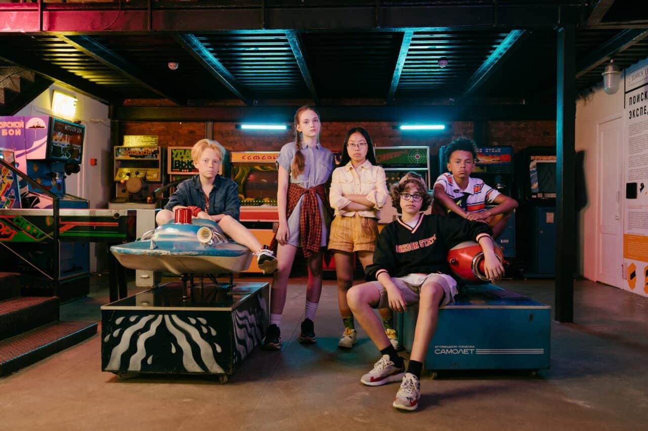 group of people sitting on blue table