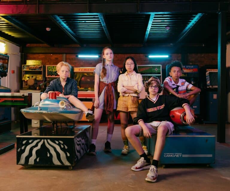 group of people sitting on blue table