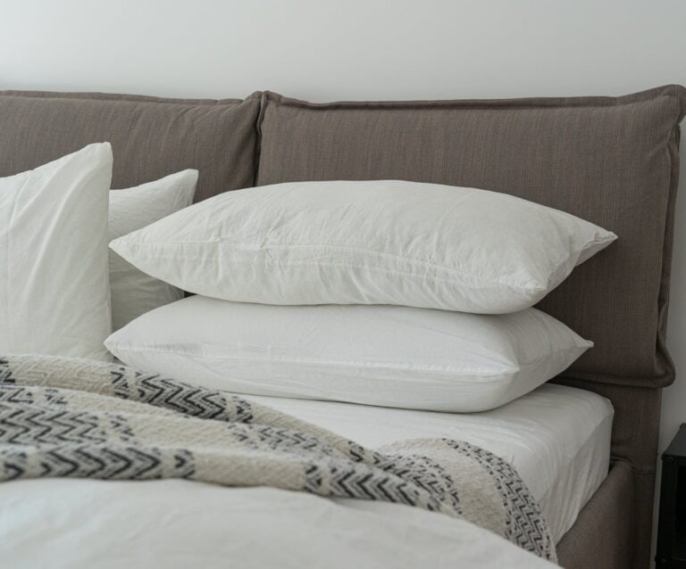 white pillows on a bed