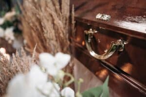 close up shot of a brown wooden coffin