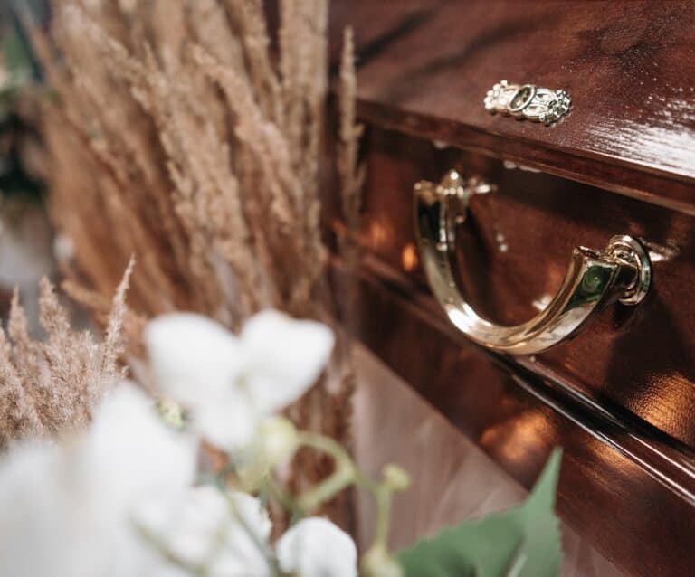 close up shot of a brown wooden coffin