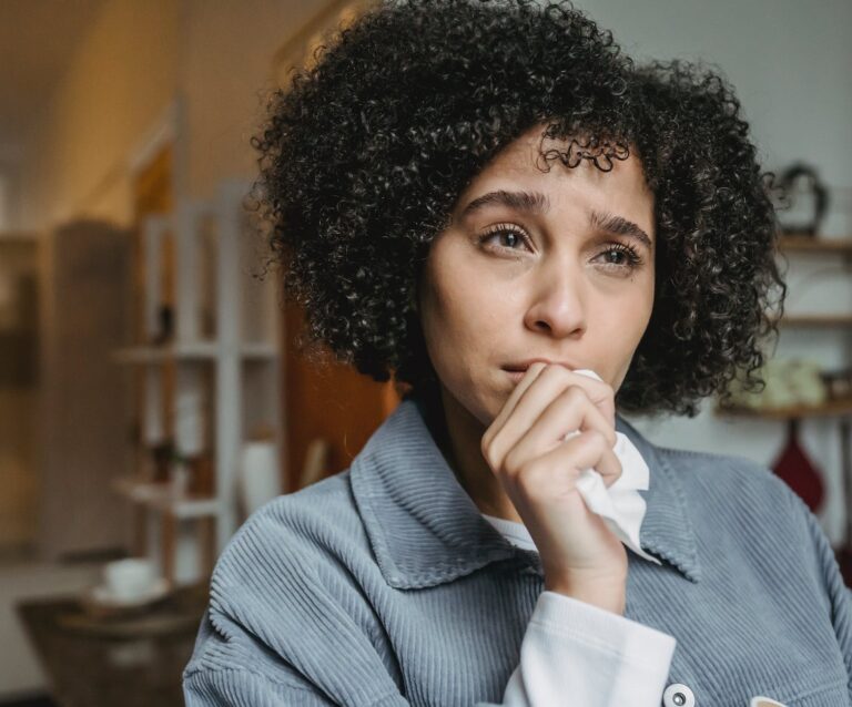 crying upset black female with tissue