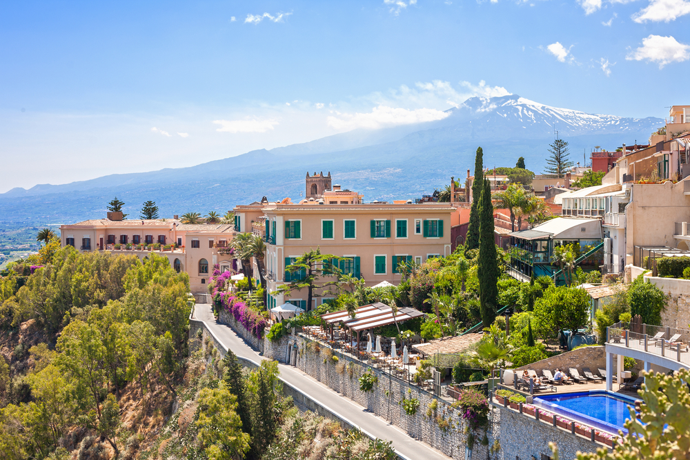 View of Taormina with Etna volcano int the back in Sicily, Italy