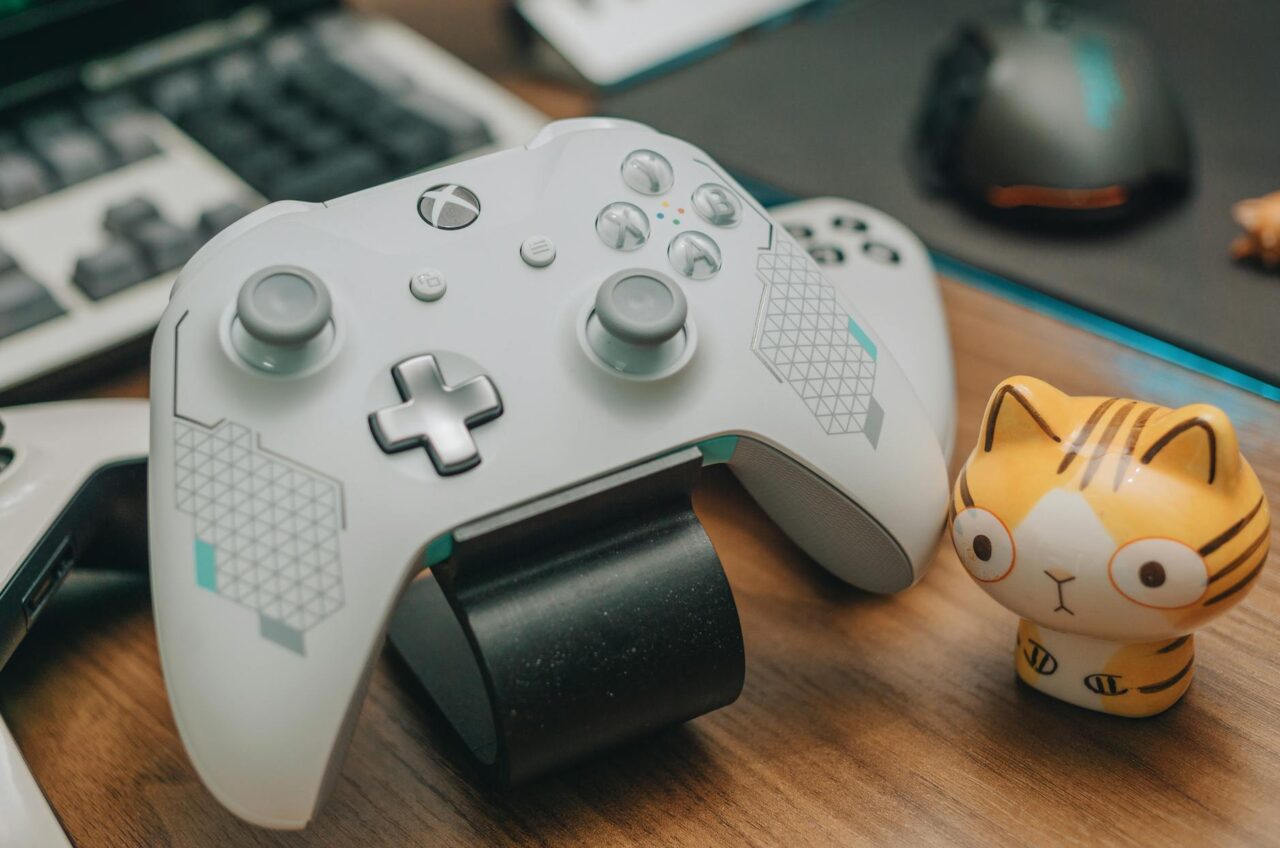 white xbox controller on brown wooden surface - Careers For Children Who Love Gaming