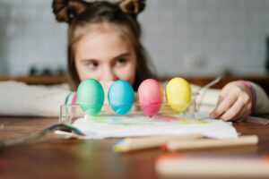 four colored eggs on palette tray