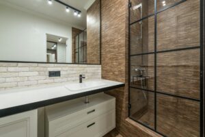 interior of modern bathroom with shower cabin and sink